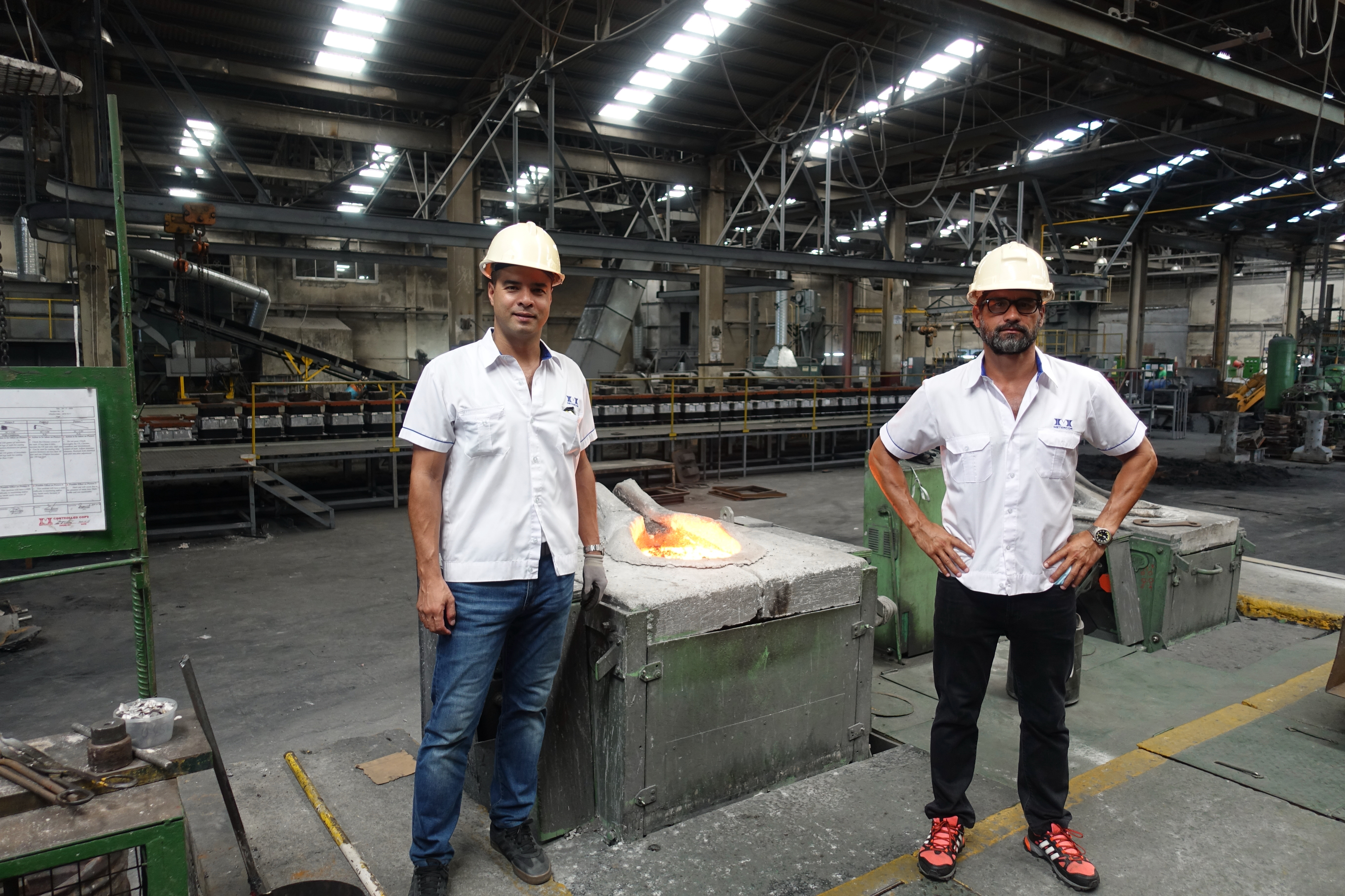The Fansler brothers on the METERCOR foundry floor, Batangas