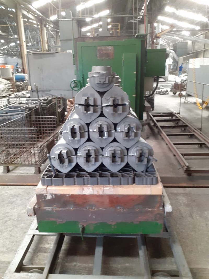 A car of freshly cast glass mold castings waiting in front of the annealing oven