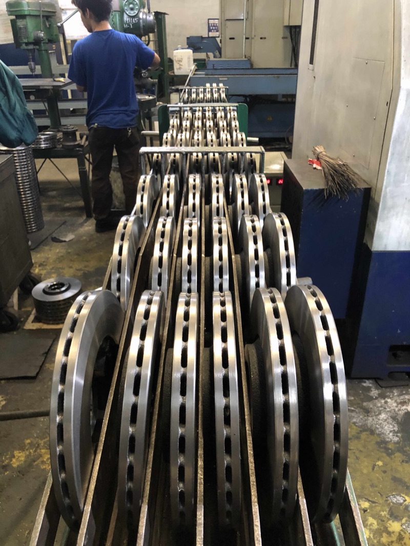 Rows of freshly machined ventilated brake discs on the finishing line in the Metercor machine shop