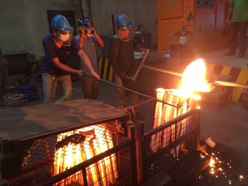 Molten stainless poured into hot ceramic shell molds in the investment casting line