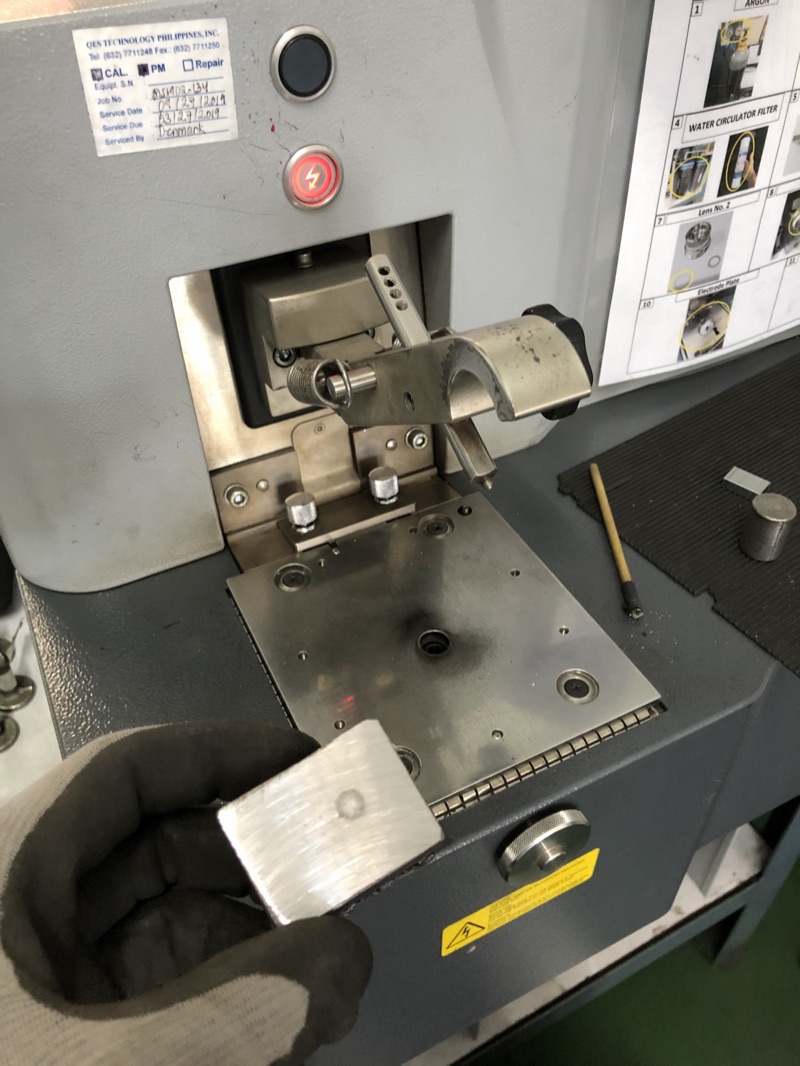 Metal sample clamped on the optical emission spectrometer