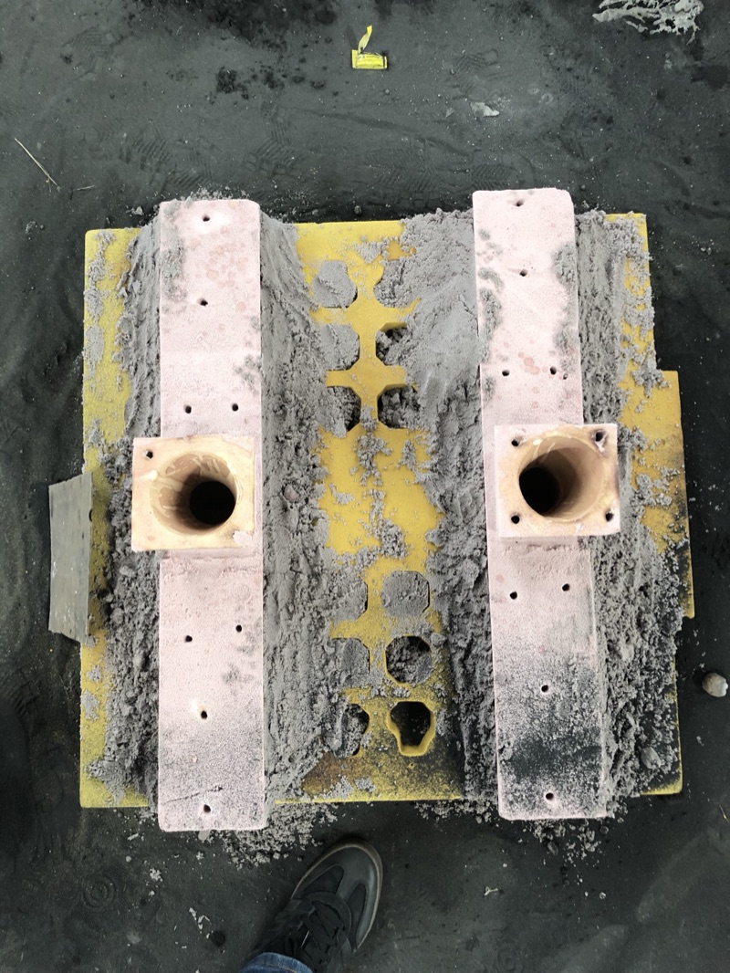 A no-bake sand mold with cores and pouring cups set, ready for pouring